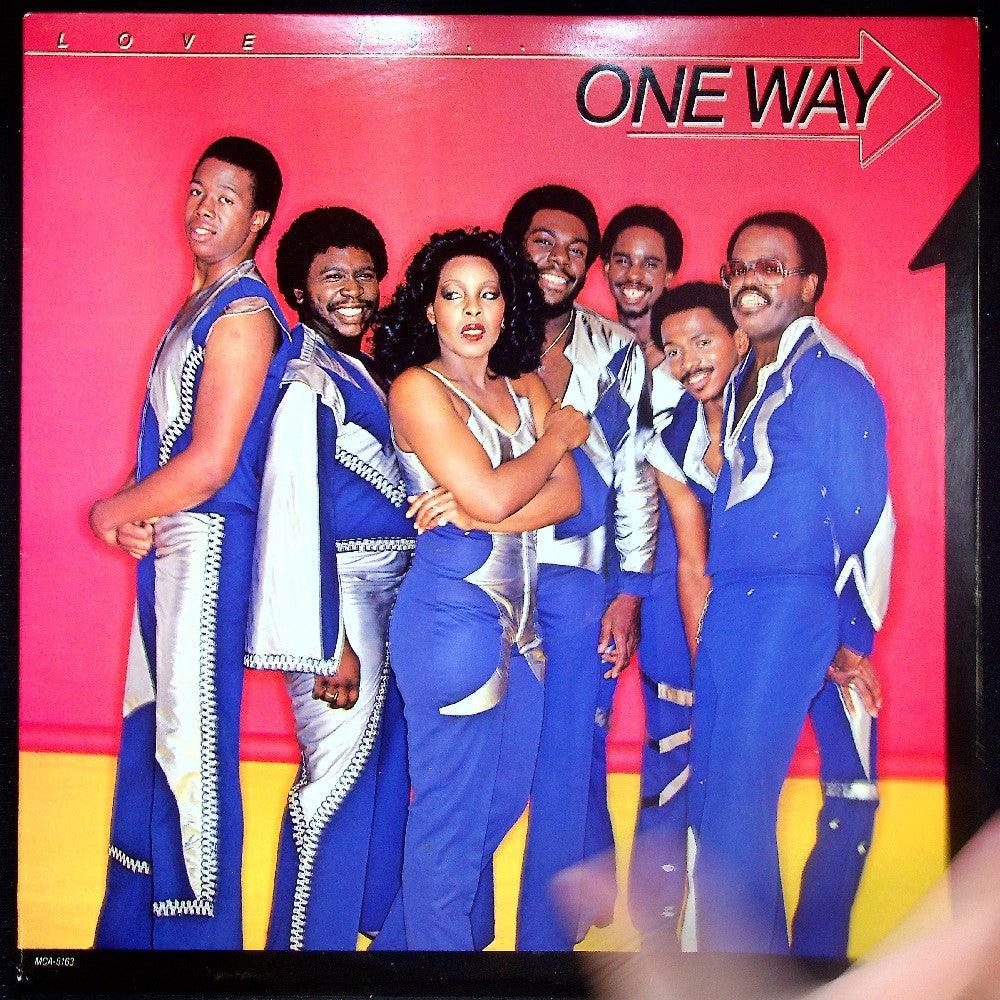 EBOND One Way - Love Is... One Way Vinile V027118