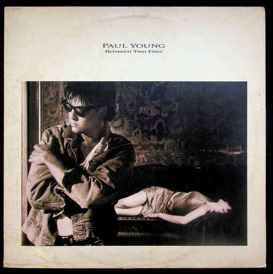 EBOND Paul Young Between Two Fires Vinile V062105