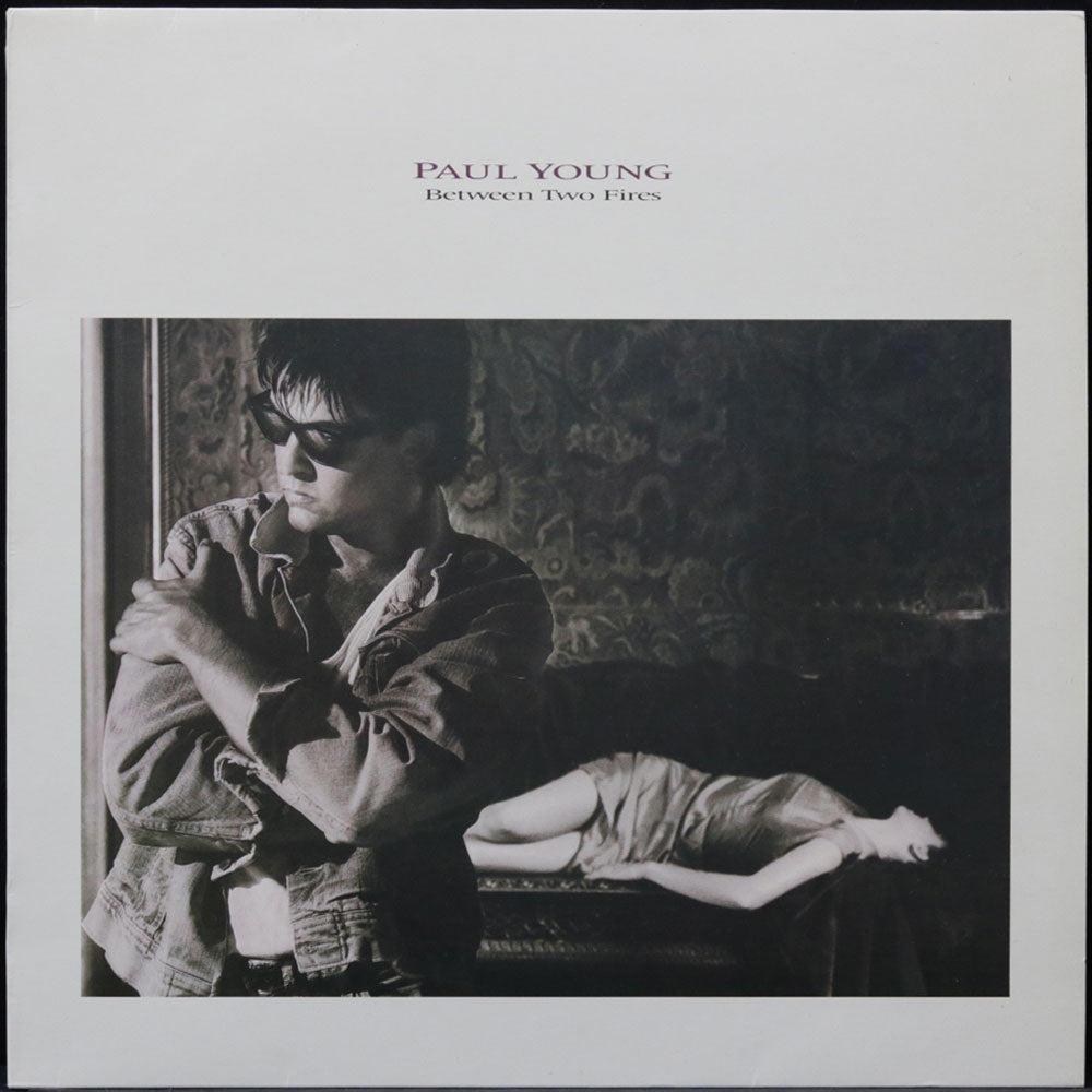 EBOND Paul Young - Between Two Fires Vinile V014005