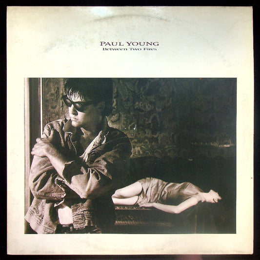 EBOND Paul Young - Between Two Fires Vinile V021135