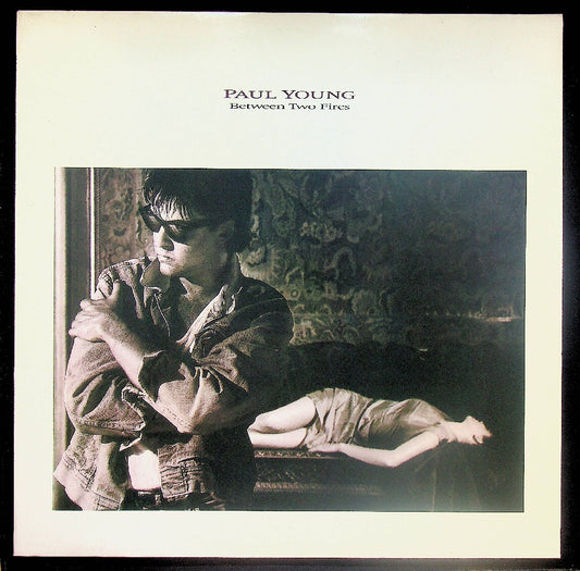 EBOND Paul Young - Between Two Fires Vinile V037112