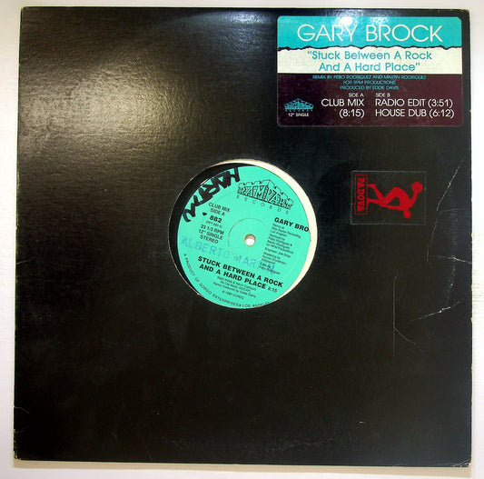 EBOND Gary Brock - Stuck Between A Rock And A Hard Place Vinile V120100